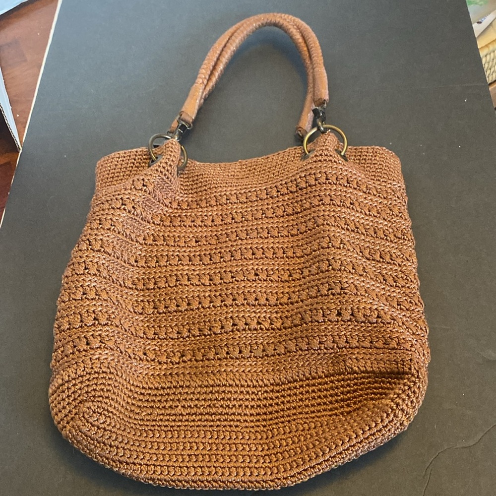 Vintage The Sak brown woven handbag.